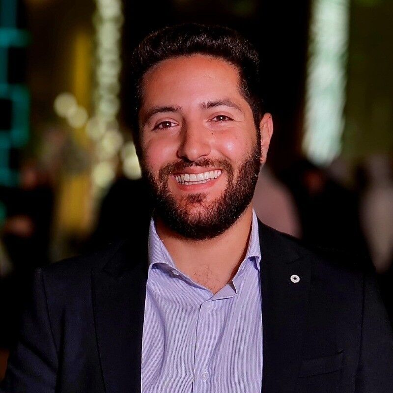 Smiling headshot of Mahmoud from Blockchain Intelligence Group, exuding a friendly and professional demeanor.