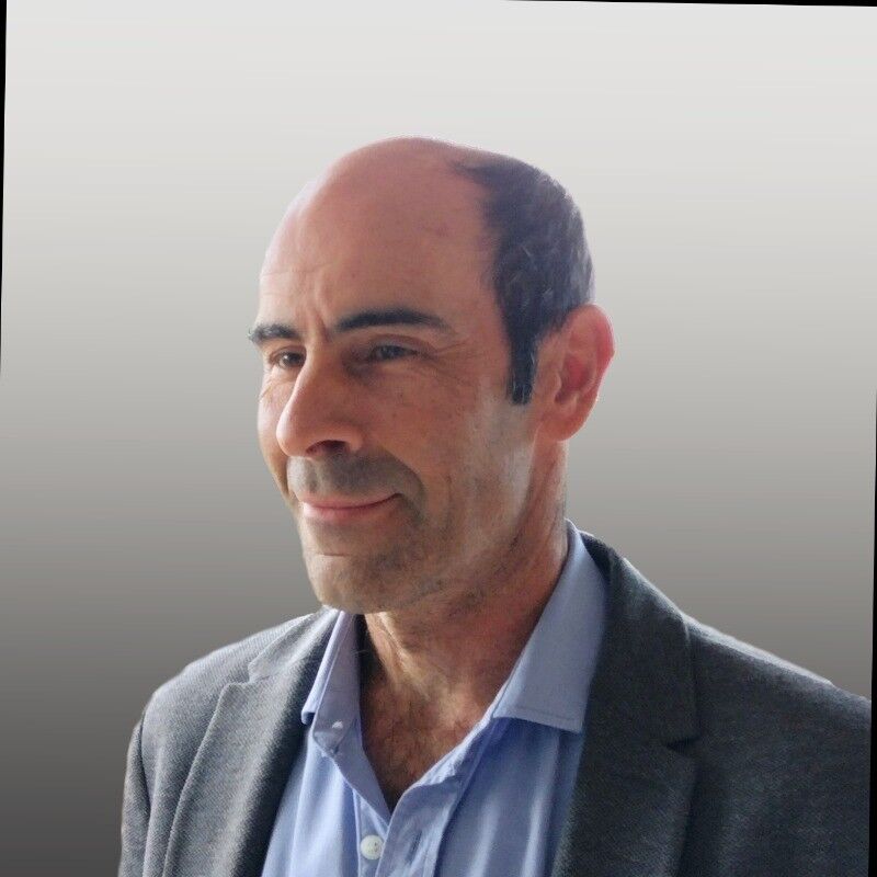 Professional headshot of Mariano from Blockchain Intelligence Group, displaying a confident and approachable look.